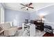 Comfortable home office featuring a ceiling fan, neutral carpet, and workspace at 423 Holly Grove Church Rd, Peachtree City, GA 30269