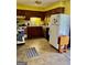 Efficient kitchen with tile floors, wooden cabinets, and ample counter space at 924 Polk Rd, Moreland, GA 30259