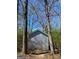 The exterior of a simple metal storage shed is pictured at 924 Polk Rd, Moreland, GA 30259