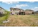 Expansive backyard with a patio, screened porch, and manicured lawn, ideal for outdoor activities and relaxation at 3225 Alhambra Cir, Hampton, GA 30228