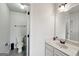 Clean bathroom with white fixtures and cabinets, a toilet, and a simple design with an off white color scheme at 3225 Alhambra Cir, Hampton, GA 30228