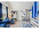 Charming Bedroom with blue and white decor, including a crib, seating, storage and decorative wall accents at 3225 Alhambra Cir, Hampton, GA 30228