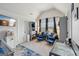 Elegant Bedroom with vaulted ceilings, blue and white decor, plush seating, and ample natural light at 3225 Alhambra Cir, Hampton, GA 30228