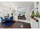 View of dining room which is open to the living room and features a stylish chandelier at 3225 Alhambra Cir, Hampton, GA 30228
