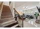Open foyer with hardwood staircase leading to the living area. Bright and airy at 3225 Alhambra Cir, Hampton, GA 30228