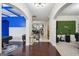 Grand foyer with dark hardwood floors and modern chandelier offers a welcoming entrance at 3225 Alhambra Cir, Hampton, GA 30228