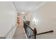 Upstairs hallway with neutral carpet and wall color at 3225 Alhambra Cir, Hampton, GA 30228
