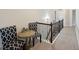 Hallway with table and chairs near staircase at 3225 Alhambra Cir, Hampton, GA 30228