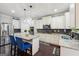 Modern kitchen featuring granite countertops, stainless steel appliances, and a functional center island at 3225 Alhambra Cir, Hampton, GA 30228