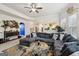 Spacious living room with large sectional, stylish decor, and open access to the kitchen at 3225 Alhambra Cir, Hampton, GA 30228