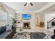 Bright living room with a fireplace, TV, tile floors, and comfortable sectional sofa at 3225 Alhambra Cir, Hampton, GA 30228