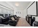 A spacious home theater room with comfortable seating and large screen at 3225 Alhambra Cir, Hampton, GA 30228