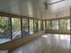 Sunroom with large windows, offering a view of the surrounding greenery at 4889 Wedgewood Way, Stone Mountain, GA 30088