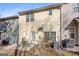 View of the backyard with a patio set on a concrete pad and an air conditioning unit at 2205 Hyssop Way, Buford, GA 30519