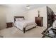 A bedroom featuring carpet, a ceiling fan, and a mounted television at 2205 Hyssop Way, Buford, GA 30519