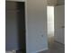 Spacious closet adjacent to a bedroom showcases ample storage and easy access at 7484 Knoll Hollow Rd, Lithonia, GA 30058