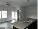 Open-concept kitchen and living area featuring granite countertops, and a view of the door and window at 7484 Knoll Hollow Rd, Lithonia, GA 30058
