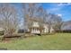 Expansive backyard featuring mature trees and landscaping, ideal for outdoor activities at 912 Shadow Ridge Cir, Stockbridge, GA 30281