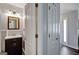 A tidy bathroom featuring a modern vanity, framed mirror, and stylish light fixture at 912 Shadow Ridge Cir, Stockbridge, GA 30281