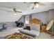 Large bedroom with carpet and ceiling fans and a decorative peacock at 912 Shadow Ridge Cir, Stockbridge, GA 30281