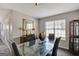 Stylish dining area featuring a glass-top table and modern décor at 912 Shadow Ridge Cir, Stockbridge, GA 30281