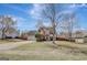Wide shot of a two-story home with a long driveway and lush green lawn at 912 Shadow Ridge Cir, Stockbridge, GA 30281