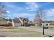 Suburban home featuring an attached garage, manicured lawn and mature trees at 912 Shadow Ridge Cir, Stockbridge, GA 30281