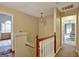 Hallway features hardwood railing and access to bedrooms on both sides at 912 Shadow Ridge Cir, Stockbridge, GA 30281