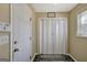 Hallway features a white door, bi-fold closet and laundry themed floor mat at 912 Shadow Ridge Cir, Stockbridge, GA 30281