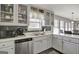 Bright kitchen featuring stainless steel appliances, ample counter space, and stylish gray backsplash at 912 Shadow Ridge Cir, Stockbridge, GA 30281