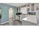 Well-lit kitchen with white cabinets, stainless steel appliances, and checkered tile backsplash at 912 Shadow Ridge Cir, Stockbridge, GA 30281