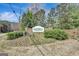 Stone monument sign at Walden community entrance with landscaped greenery at 912 Shadow Ridge Cir, Stockbridge, GA 30281