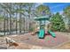Community playground with slide and shaded play area near a bench at 912 Shadow Ridge Cir, Stockbridge, GA 30281