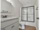 Modern bathroom showcasing updated fixtures, a shower with sliding door, and a toilet at 202 Saltlick Trce, Peachtree City, GA 30269