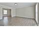 Bright living room featuring hardwood floors, neutral walls, crown molding, and abundant natural light at 202 Saltlick Trce, Peachtree City, GA 30269