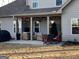 Back patio featuring comfortable outdoor seating and string lights, perfect for relaxing at 275 Nutt Dr, Locust Grove, GA 30248