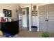 Bedroom with gray walls, a black dresser, decor, and view into the hallway at 275 Nutt Dr, Locust Grove, GA 30248