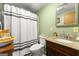 Compact bathroom with a vanity, shower, and neutral-colored walls at 1055 Adrian Sw Cir, Conyers, GA 30094