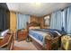 Bedroom features wood paneling, a wooden bed frame and dresser set, offering a traditional aesthetic at 1055 Adrian Sw Cir, Conyers, GA 30094