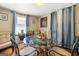 Bright dining area with a glass-top table, iron chairs, and natural light at 1055 Adrian Sw Cir, Conyers, GA 30094