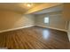 Large basement offering ample space, featuring finished flooring and a small window at 2795 Oxford Dr, Decatur, GA 30034