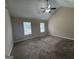 Spacious bedroom with vaulted ceiling, carpet, ceiling fan and two windows at 2795 Oxford Dr, Decatur, GA 30034