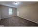 Cozy bedroom with plush carpeting and a window providing natural light at 2795 Oxford Dr, Decatur, GA 30034