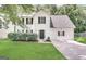 Charming two-story white home with manicured lawn, dark shutters, and an attached garage at 2795 Oxford Dr, Decatur, GA 30034