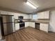 Modern kitchen equipped with stainless steel appliances, white cabinets, and granite countertops at 2795 Oxford Dr, Decatur, GA 30034