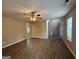 Spacious living area with hardwood floors, ceiling fan, and staircase leading to the upper level at 2795 Oxford Dr, Decatur, GA 30034