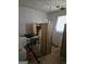 Cluttered bedroom featuring stacked boxes, a window and bare wood floors at 9135 Ford Sw St, Covington, GA 30014