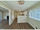 Open dining room flows into a modern kitchen with granite countertops and white cabinets at 1380 Margarette Dr, Decatur, GA 30035