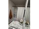 Bathroom features a granite countertop, white shower with patterned curtain, and a white toilet at 235 Ivey Ter # 40, Temple, GA 30179