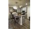 Kitchen featuring stainless steel appliances, gray cabinets, granite countertops, pendant lighting, and a kitchen island at 235 Ivey Ter # 40, Temple, GA 30179